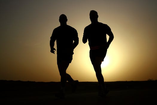 Two men running after hip replacement
